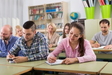 Adults learning in a classroom